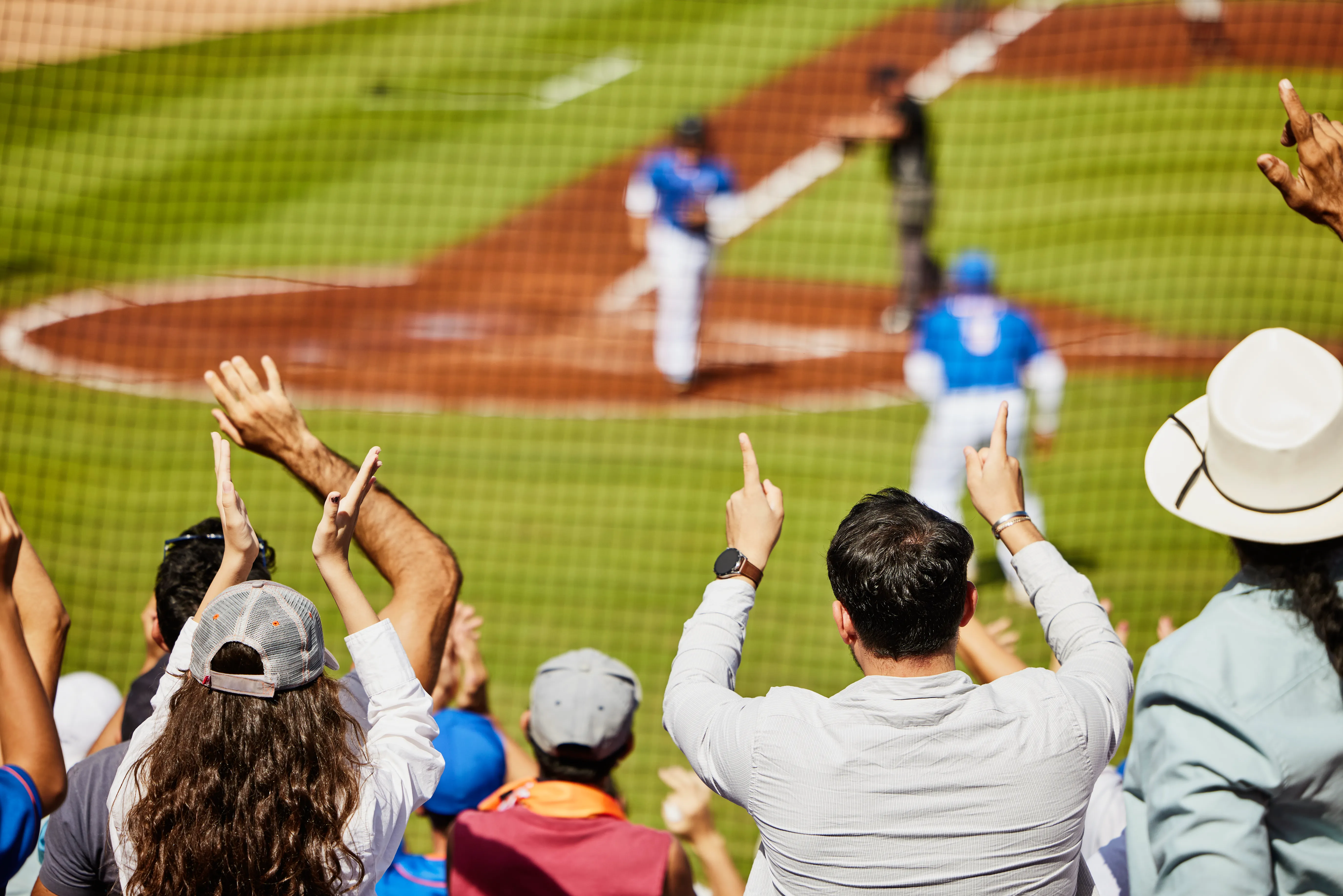 Fans enjoying a baseball game.